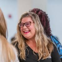Attendees mingling prior to event start 26